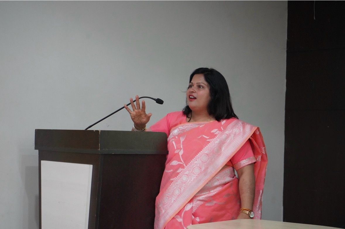 Speaker addressing students from the podium at an ASCEND session