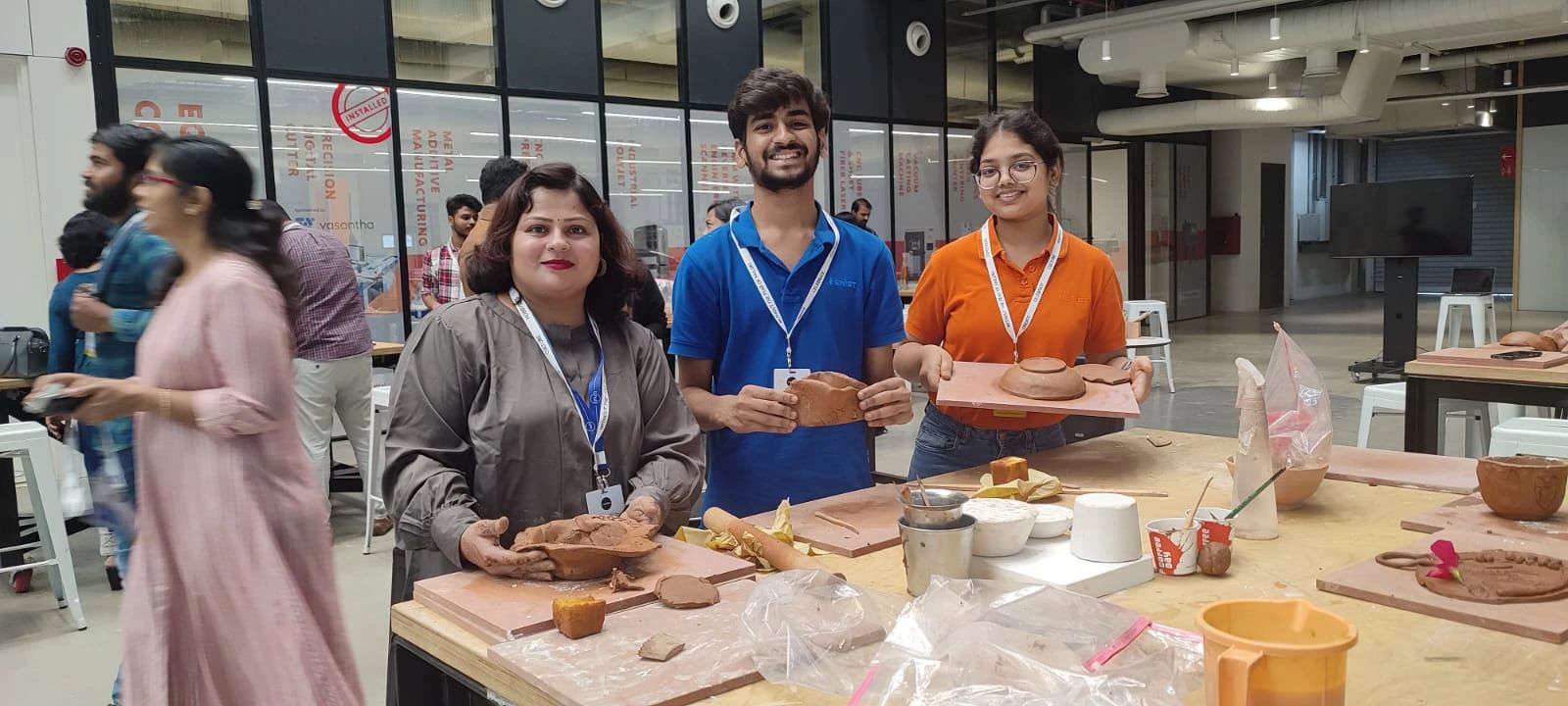 Students and faculty prototyping with clay moulds in the Sreenidhi makerspace alongside additive manufacturing equipment